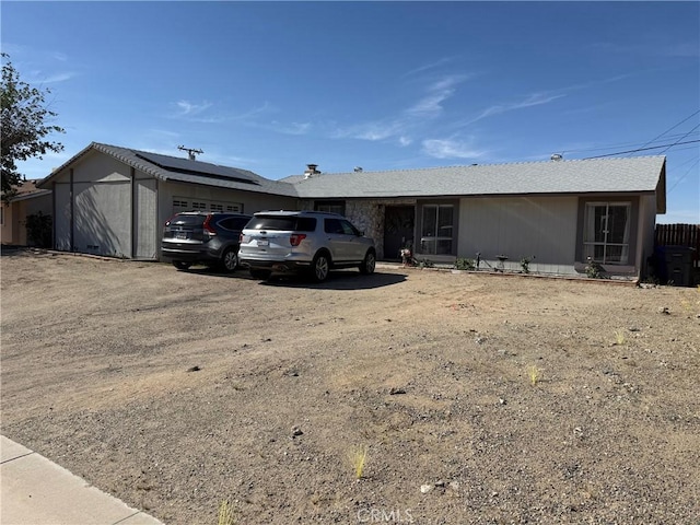 37098 San Bruno Ave, Barstow, CA 92311 - single story home featuring an attached garage, solar panels, and driveway