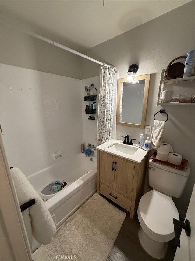 37098 San Bruno Ave, Barstow, CA 92311 - bathroom with vanity, shower / tub combo with curtain, toilet, and wood finished floors