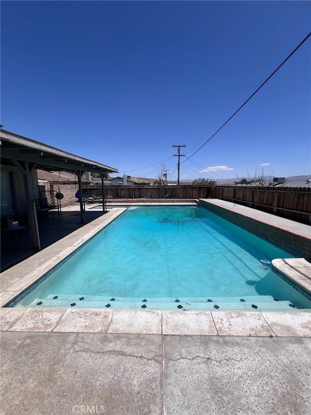 37098 San Bruno Ave, Barstow, CA 92311 - view of swimming pool featuring a fenced backyard and a patio area