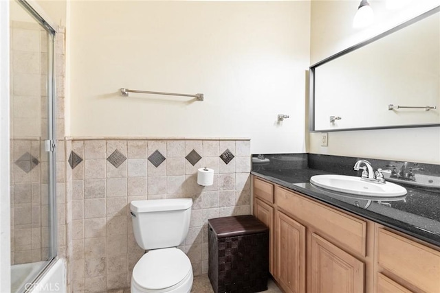 1935 Wollam St, Los Angeles, CA 90065 - full bath featuring vanity, toilet, tile walls, combined bath / shower with glass door, and a wainscoted wall