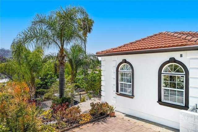 1935 Wollam St, Los Angeles, CA 90065 - view of side of home featuring stucco siding and a tile roof