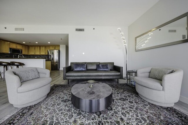 411 W Seaside Way Unit 1103, Long Beach, CA 90802 - living room with wood finished floors, recessed lighting, and baseboards