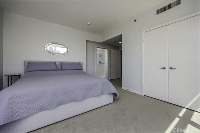 411 W Seaside Way Unit 1103, Long Beach, CA 90802 - carpeted bedroom featuring a closet and baseboards