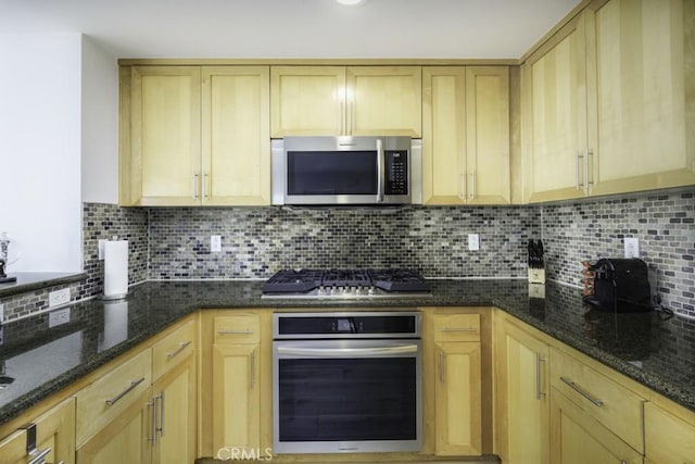 411 W Seaside Way Unit 1103, Long Beach, CA 90802 - kitchen featuring stainless steel appliances, light brown cabinetry, backsplash, and dark stone counters