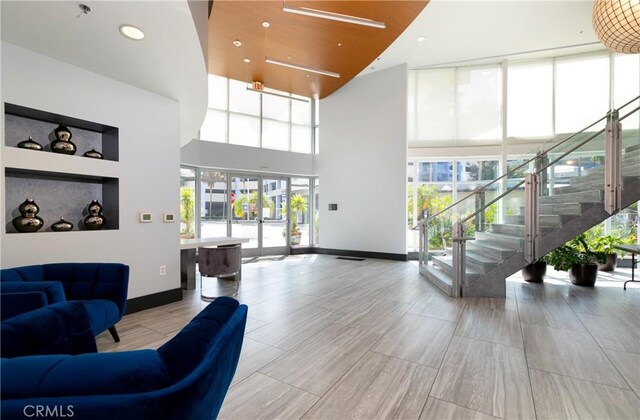 411 W Seaside Way Unit 1103, Long Beach, CA 90802 - common area featuring a towering ceiling, stairway, and recessed lighting