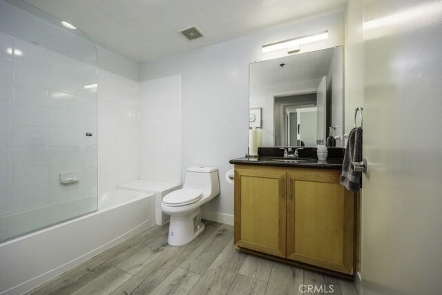 411 W Seaside Way Unit 1103, Long Beach, CA 90802 - bathroom with toilet, vanity, wood finished floors, shower / washtub combination, and baseboards
