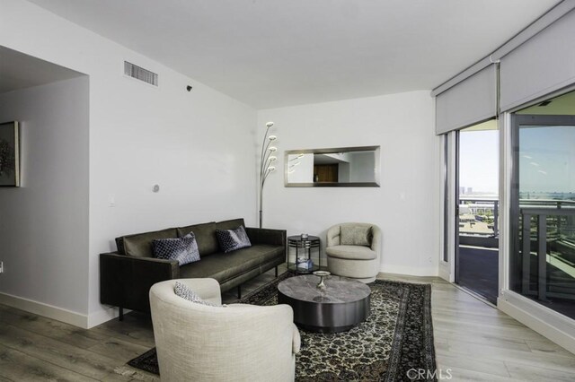 411 W Seaside Way Unit 1103, Long Beach, CA 90802 - living area featuring light wood-style floors and baseboards