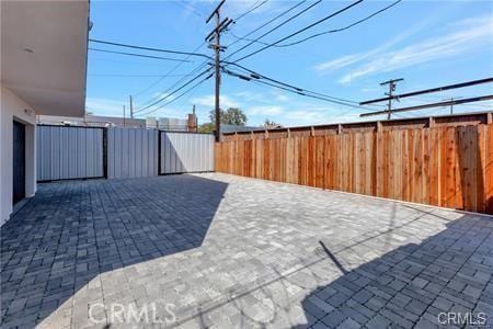 8418 S Main St, Los Angeles, CA 90003 - fenced backyard with a patio area