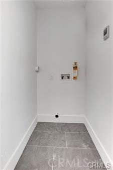 8418 S Main St, Los Angeles, CA 90003 - washroom with washer hookup, tile patterned flooring, and baseboards
