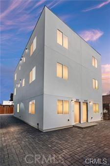 8418 S Main St, Los Angeles, CA 90003 - back of house with stucco siding and a patio