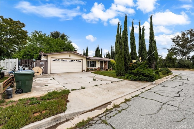 13397 Robin Ct, Yucaipa, CA 92399 - ranch-style house featuring an attached garage, concrete driveway, and stucco siding
