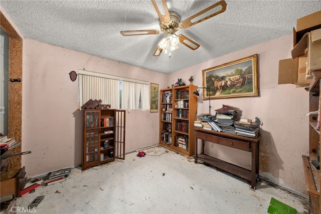 13397 Robin Ct, Yucaipa, CA 92399 - office featuring ceiling fan, concrete floors, and a textured ceiling