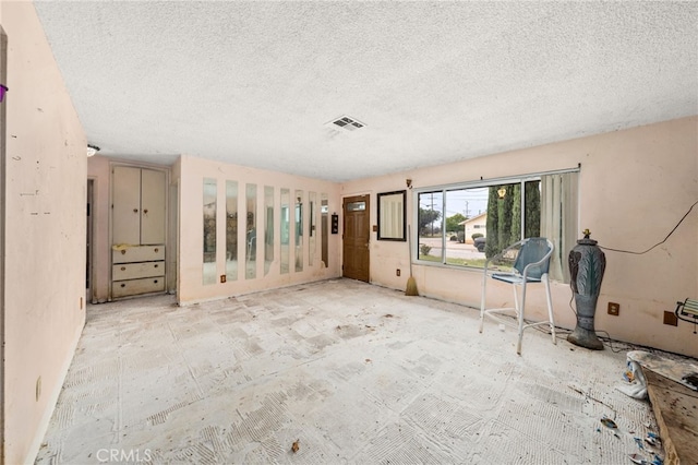 13397 Robin Ct, Yucaipa, CA 92399 - unfurnished room featuring a textured ceiling