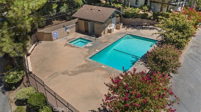 10831 Roycroft St Unit 8, Sun Valley, CA 91352 - community pool featuring a patio area, a fenced backyard, a hot tub, and an outbuilding
