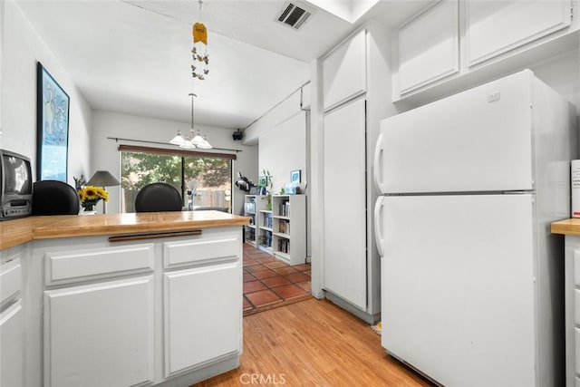 10831 Roycroft St Unit 8, Sun Valley, CA 91352 - kitchen featuring freestanding refrigerator, white cabinetry, an office area, a chandelier, and light wood finished floors