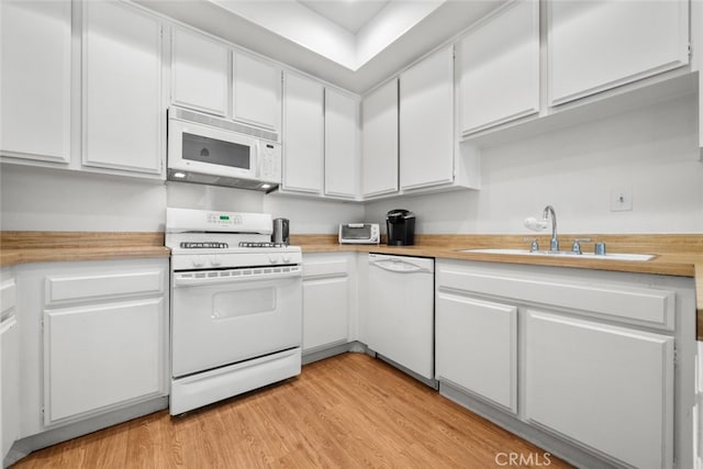 10831 Roycroft St Unit 8, Sun Valley, CA 91352 - kitchen featuring white appliances, a sink, light countertops, and white cabinets