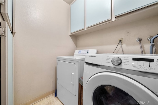 10831 Roycroft St Unit 8, Sun Valley, CA 91352 - laundry room featuring independent washer and dryer, cabinet space, and baseboards