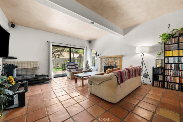 10831 Roycroft St Unit 8, Sun Valley, CA 91352 - living room featuring a warm lit fireplace and tile patterned flooring
