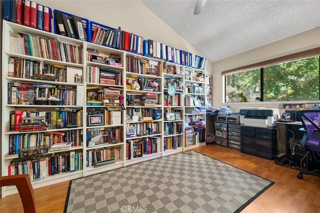 10831 Roycroft St Unit 8, Sun Valley, CA 91352 - office area with lofted ceiling, a textured ceiling, wood finished floors, and bookshelves