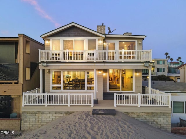 4177 Ocean Dr, Oxnard, CA 93035 - view of front facade featuring a balcony and a chimney