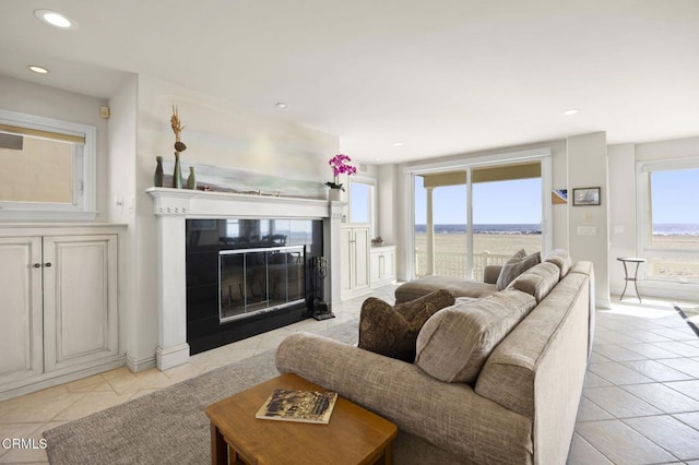 4177 Ocean Dr, Oxnard, CA 93035 - living room featuring light tile patterned floors, recessed lighting, and a fireplace with flush hearth