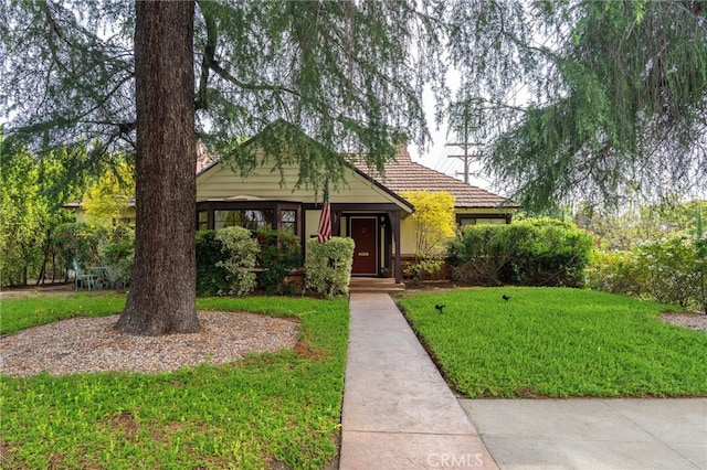 14060 Chandler Blvd, Sherman Oaks, CA 91401 - view of front of home featuring a front lawn and a tiled roof