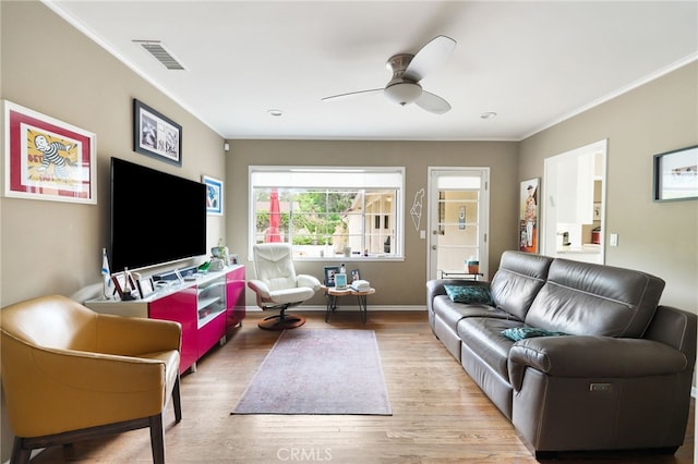 14060 Chandler Blvd, Sherman Oaks, CA 91401 - living area featuring crown molding, wood finished floors, a ceiling fan, and baseboards