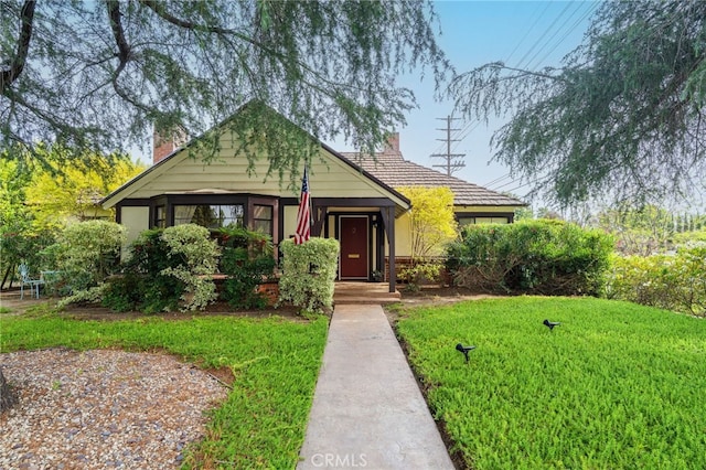 14060 Chandler Blvd, Sherman Oaks, CA 91401 - view of front of house with a chimney and a front lawn