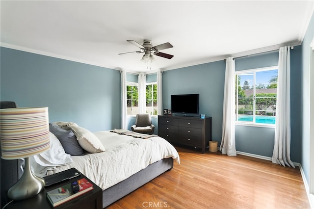 14060 Chandler Blvd, Sherman Oaks, CA 91401 - bedroom featuring ornamental molding, light wood-style flooring, baseboards, and ceiling fan