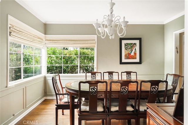 14060 Chandler Blvd, Sherman Oaks, CA 91401 - dining space with light wood-style floors, plenty of natural light, a chandelier, and ornamental molding