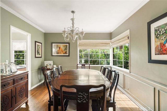 14060 Chandler Blvd, Sherman Oaks, CA 91401 - dining room with a chandelier, crown molding, a wainscoted wall, light wood-style floors, and a decorative wall