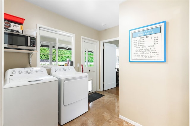 14060 Chandler Blvd, Sherman Oaks, CA 91401 - laundry room with washing machine and clothes dryer and light tile patterned flooring