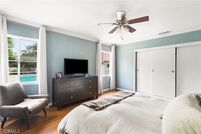 14060 Chandler Blvd, Sherman Oaks, CA 91401 - bedroom featuring wood finished floors, a closet, a ceiling fan, and baseboards