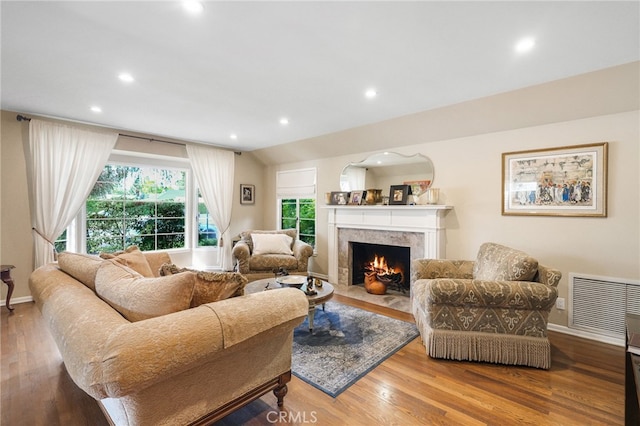 14060 Chandler Blvd, Sherman Oaks, CA 91401 - living room with wood finished floors, baseboards, a fireplace, and recessed lighting