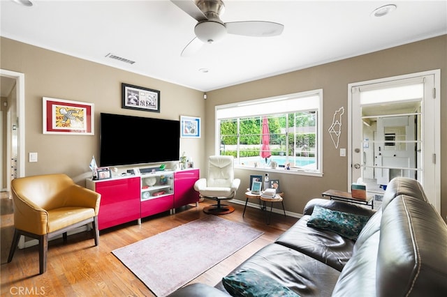 14060 Chandler Blvd, Sherman Oaks, CA 91401 - living room featuring wood finished floors, ceiling fan, ornamental molding, and baseboards