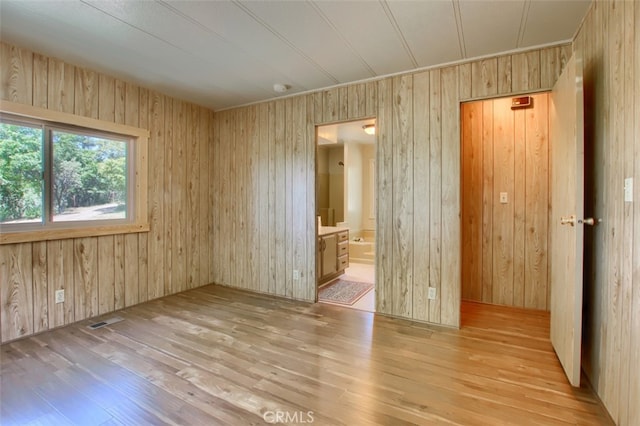 2843 E Westfall Rd, Mariposa, CA 95338 - empty room with hardwood / wood-style floors and wood walls