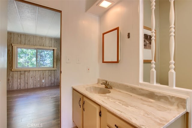2843 E Westfall Rd, Mariposa, CA 95338 - bathroom featuring wood finished floors, vanity, and wood walls