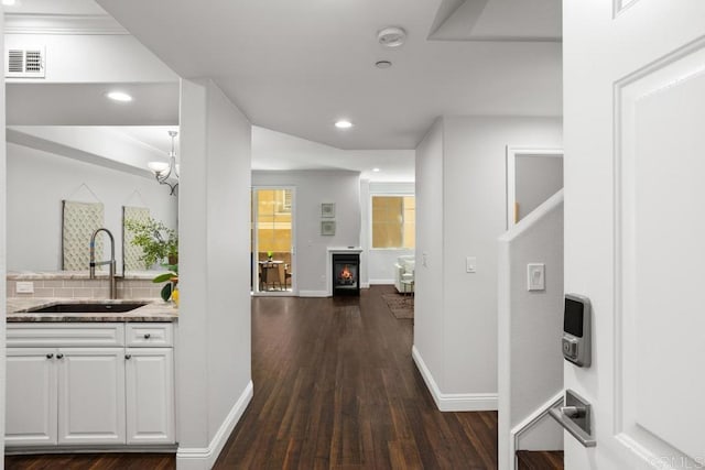2778 Carlsbad Blvd Unit 201, Carlsbad, CA 92008 - hall featuring a sink, dark wood-style flooring, baseboards, and recessed lighting