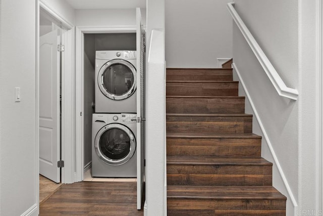 2778 Carlsbad Blvd Unit 201, Carlsbad, CA 92008 - laundry room featuring stacked washer and clothes dryer and wood finished floors