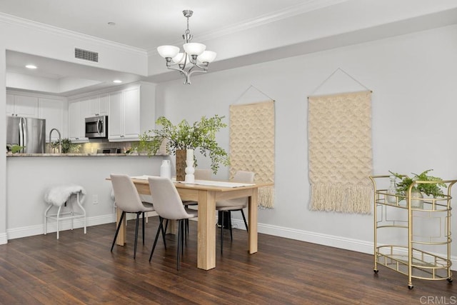 2778 Carlsbad Blvd Unit 201, Carlsbad, CA 92008 - dining area featuring a chandelier, wood finished floors, crown molding, baseboards, and recessed lighting