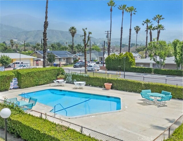 345 W 41st St, San Bernardino, CA 92407 - community pool with a patio, a mountain view, and a residential view