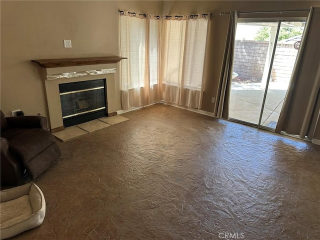 1715 Lake Way, Lancaster, CA 93534 - unfurnished living room with a fireplace with flush hearth and baseboards