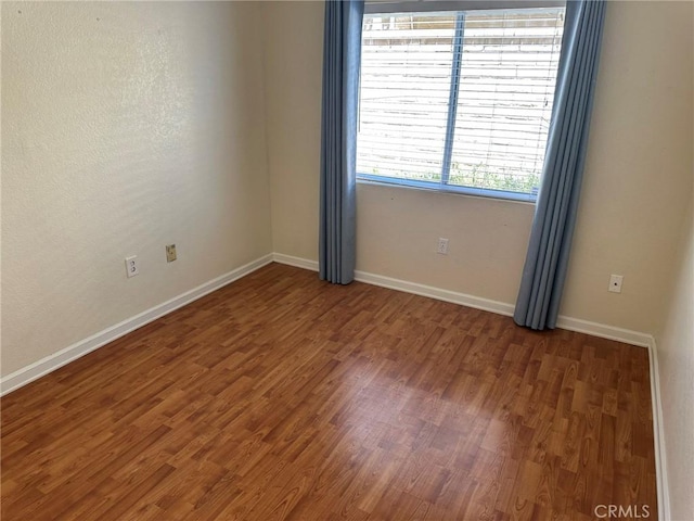 1715 Lake Way, Lancaster, CA 93534 - spare room with wood finished floors and baseboards