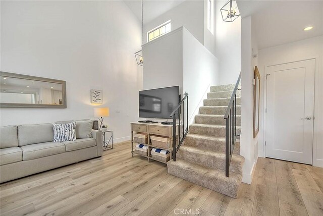 2693 Lookout Cir, Chino Hills, CA 91709 - living area with a high ceiling, stairs, wood finished floors, baseboards, and recessed lighting