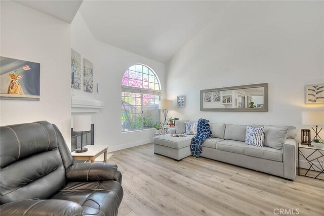 2693 Lookout Cir, Chino Hills, CA 91709 - living room featuring wood finished floors, high vaulted ceiling, and baseboards