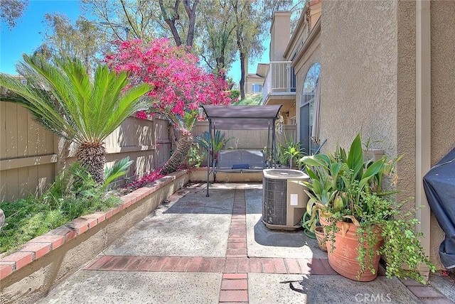2693 Lookout Cir, Chino Hills, CA 91709 - fenced backyard with a jacuzzi, a patio, and central AC unit