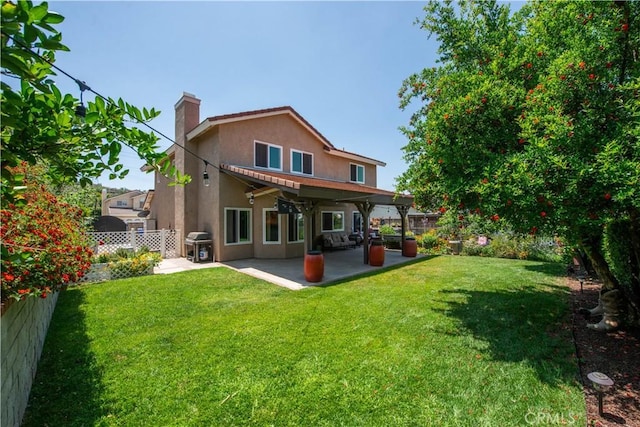 22447 Poplar St, Saugus, CA 91390 - rear view of house with stucco siding, a patio area, and a chimney