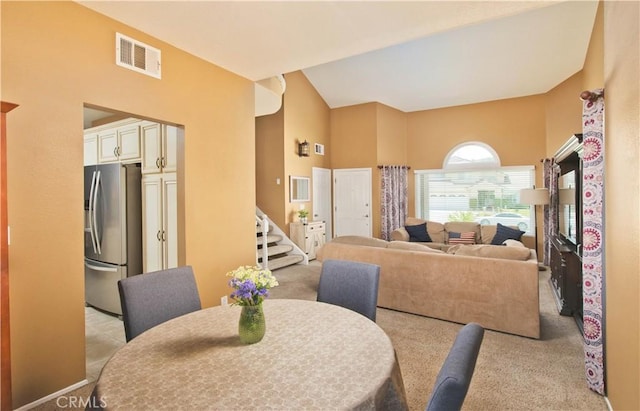 22447 Poplar St, Saugus, CA 91390 - dining room featuring stairs, high vaulted ceiling, and light colored carpet