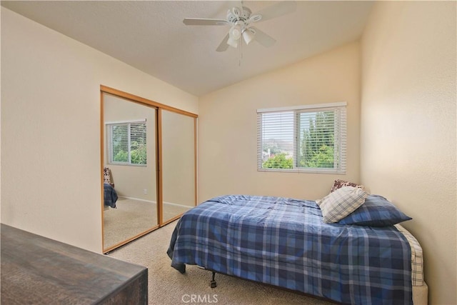 22447 Poplar St, Saugus, CA 91390 - carpeted bedroom with multiple windows, vaulted ceiling, a closet, and a ceiling fan