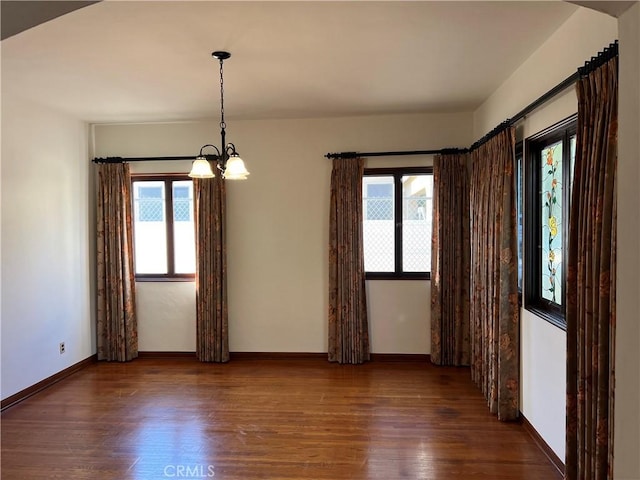 1465 N Euclid Ave, Upland, CA 91786 - spare room featuring wood finished floors, a chandelier, and baseboards